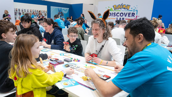 People of all ages playing the Pokémon Trading Card Game