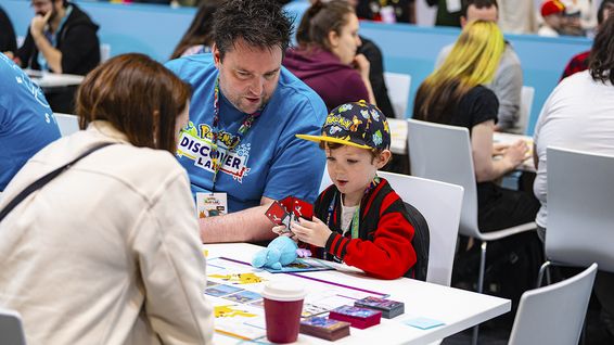 A child learning to play a card game.
